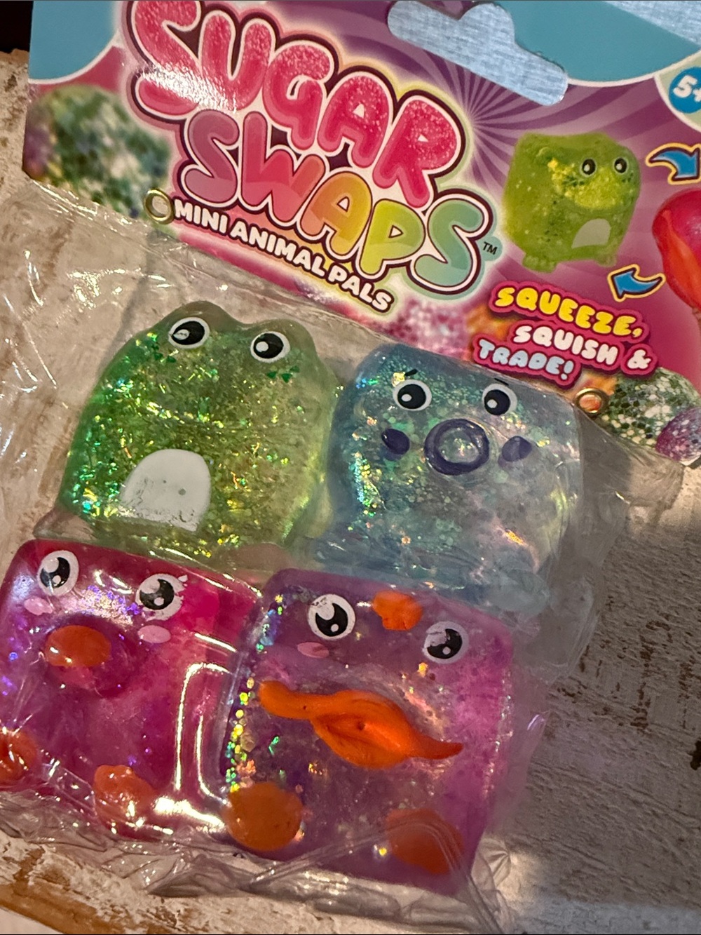2/$25 Mini face cube Pals - Glitter Squishy Toy Set (Green, Blue, Pink, Purple)